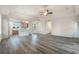 Open-concept living room featuring hardwood floors and easy access to the dining and kitchen areas at 61 Yale Pl., Pawleys Island, SC 29585