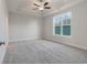 Inviting bedroom with tray ceilings, a ceiling fan, carpet and lots of natural light at 61 Yale Pl., Pawleys Island, SC 29585