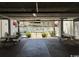 Shared common area under a building featuring picnic tables and potted plants with the pool area visible behind at 6103 N Ocean Blvd. # C-6, North Myrtle Beach, SC 29582