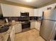 Modern kitchen featuring stainless steel appliances and white cabinets at 6103 N Ocean Blvd. # C-6, North Myrtle Beach, SC 29582