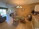 A welcoming living area and a dining space with glass top table and wicker chairs at 6103 N Ocean Blvd. # C-6, North Myrtle Beach, SC 29582
