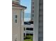 Seaside view between buildings featuring parked cars in a garage, sandy beach, and the ocean at 6103 N Ocean Blvd. # C-6, North Myrtle Beach, SC 29582