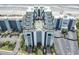 Aerial view of the beachside resort featuring a rooftop pool, expansive balconies, and vibrant architecture at 6804 N Ocean Blvd. # 829, Myrtle Beach, SC 29572