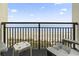 Relaxing ocean view from the condo's balcony with comfortable chairs and a small table at 6804 N Ocean Blvd. # 829, Myrtle Beach, SC 29572