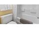 Bright bathroom featuring a white bathtub and shower, with a white toilet, and gray towels at 6804 N Ocean Blvd. # 829, Myrtle Beach, SC 29572