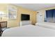 Well-appointed bedroom with two beds, dresser, and TV, perfect for relaxation with a view in the mirror at 6804 N Ocean Blvd. # 829, Myrtle Beach, SC 29572