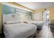 Cozy bedroom features two comfortable beds, beach decor, and a relaxing atmosphere with tile floor at 6804 N Ocean Blvd. # 829, Myrtle Beach, SC 29572