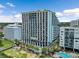 Exterior of a multi-story condo complex featuring multiple balconies, pool, and manicured landscaping at 6804 N Ocean Blvd. # 829, Myrtle Beach, SC 29572