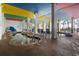 Indoor pool area with lounge chairs and hot tub surrounded by colorful decor at 6804 N Ocean Blvd. # 829, Myrtle Beach, SC 29572