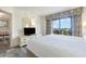 Relaxing bedroom with balcony access and large dresser with tv for convenient viewing at 7100 N Ocean Blvd. # 320, Myrtle Beach, SC 29572