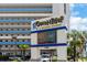The exterior view showcases the Ocean Reef Resort sign, inviting guests to a seaside vacation experience at 7100 N Ocean Blvd. # 320, Myrtle Beach, SC 29572