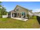 This home has a lovely backyard with a screened in porch and relaxing hammock chair at 736 Flowering Branch Ave., Little River, SC 29566