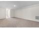Spacious basement with carpet and a utility grate on the wall at 736 Flowering Branch Ave., Little River, SC 29566
