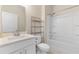 Bathroom with a shower-tub combo, vanity, and a stainless steel shelving unit at 736 Flowering Branch Ave., Little River, SC 29566