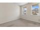 Neutral bedroom with carpet, two windows, and electrical outlets at 736 Flowering Branch Ave., Little River, SC 29566