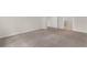 Empty carpeted bedroom with a window and neutral paint at 736 Flowering Branch Ave., Little River, SC 29566