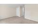 Carpeted bedroom with natural light, featuring a closet door and trim at 736 Flowering Branch Ave., Little River, SC 29566