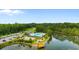 A community pool, lakeside, with ample parking, and views of lush landscaping at 736 Flowering Branch Ave., Little River, SC 29566