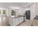 Spacious kitchen featuring an island, granite counters, and stainless steel appliances at 736 Flowering Branch Ave., Little River, SC 29566
