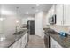 Modern kitchen with granite countertops, stainless steel appliances, and white cabinetry at 736 Flowering Branch Ave., Little River, SC 29566
