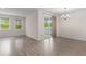 Bright, open living room with sliding glass doors and lots of natural light at 736 Flowering Branch Ave., Little River, SC 29566