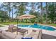 Beautiful backyard pool with a patio seating area for relaxation and outdoor enjoyment at 78 Oakmont Dr., Pawleys Island, SC 29585