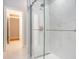 Modern bathroom showcasing a glass-enclosed shower and sleek, tiled walls at 78 Oakmont Dr., Pawleys Island, SC 29585