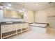 Elegant bathroom featuring double sinks, granite countertops, and a luxurious jacuzzi tub at 78 Oakmont Dr., Pawleys Island, SC 29585
