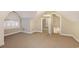 Upstairs room with carpet flooring, a small window and access to the attic at 78 Oakmont Dr., Pawleys Island, SC 29585
