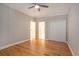 Bedroom showcasing hardwood floors, neutral walls, white trim and multiple doors at 78 Oakmont Dr., Pawleys Island, SC 29585