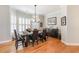 Well-lit dining room with hardwood floors, a large window and custom furniture at 78 Oakmont Dr., Pawleys Island, SC 29585