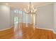 Elegant dining room featuring hardwood floors and a chandelier, adjacent to the living room at 78 Oakmont Dr., Pawleys Island, SC 29585