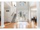 Grand foyer with hardwood floors, staircase, and elegant details offering a warm welcome at 78 Oakmont Dr., Pawleys Island, SC 29585