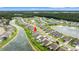 Aerial view showcasing the home's location within a beautiful community with ponds and lush landscaping at 802 Devon Estate Ave., Myrtle Beach, SC 29588