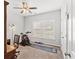 Bright bedroom space features a ceiling fan, fitness equipment and neutral walls and carpet at 802 Devon Estate Ave., Myrtle Beach, SC 29588