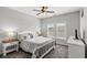 Serene bedroom showcases a queen-sized bed, matching nightstands, and soft lighting at 802 Devon Estate Ave., Myrtle Beach, SC 29588
