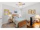 Comfortable bedroom with a ceiling fan, carpet and side tables with lamps at 802 Devon Estate Ave., Myrtle Beach, SC 29588