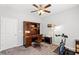 This carpeted home office area is bright and features a desk, chair, and exercise equipment at 802 Devon Estate Ave., Myrtle Beach, SC 29588