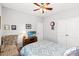 Inviting bedroom with carpet, ceiling fan, comfortable chair and white trim at 802 Devon Estate Ave., Myrtle Beach, SC 29588