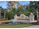 Windsor Plantation's grand entrance featuring a fountain and lush landscaping at 802 Devon Estate Ave., Myrtle Beach, SC 29588