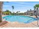 Large community pool with ample seating, lush landscaping, and clear blue water at 802 Devon Estate Ave., Myrtle Beach, SC 29588