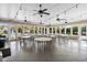Community dining area filled with tables and chairs, great for entertaining and events with an open concept at 802 Devon Estate Ave., Myrtle Beach, SC 29588