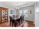 Inviting dining room with wood floors, tray ceiling, and elegant chandelier at 802 Devon Estate Ave., Myrtle Beach, SC 29588