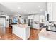 Open kitchen with stainless steel appliances, center island and granite countertops at 802 Devon Estate Ave., Myrtle Beach, SC 29588