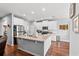 Modern kitchen with stainless steel appliances, granite countertops, and a spacious island at 802 Devon Estate Ave., Myrtle Beach, SC 29588