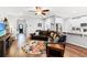 Open-concept living room with hardwood floors, leather seating, and seamless flow to the kitchen at 802 Devon Estate Ave., Myrtle Beach, SC 29588