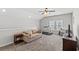 Bright second living area boasts neutral walls, plush carpeting, and comfortable furnishings at 802 Devon Estate Ave., Myrtle Beach, SC 29588