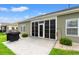 Back patio with an outdoor grill and an enclosed sunroom, perfect for relaxing and entertaining at 802 Devon Estate Ave., Myrtle Beach, SC 29588