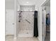 Tiled shower with shower head and a black grab bar at 802 Devon Estate Ave., Myrtle Beach, SC 29588