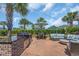 Stylish backyard featuring outdoor kitchen, patio seating, and well-maintained landscaping at 8185 Sandlapper Way, Myrtle Beach, SC 29572